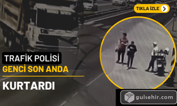 Kamyon çarpmak üzereydi! Trafik polisi YKS'den çıkan genci son anda kurtardı